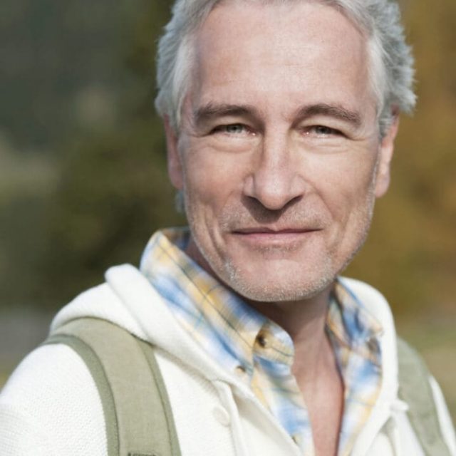Italy, South Tyrol, Mature man smiling, portrait